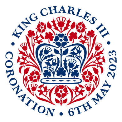 King Charles III Coronation 6th May 2023 logo - navy blue crown surrounded by a red clover, thistle, daffodil and rose pattern.